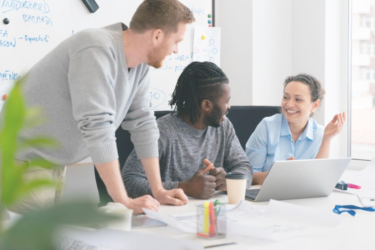 Financial planning workspace with documents and laptop