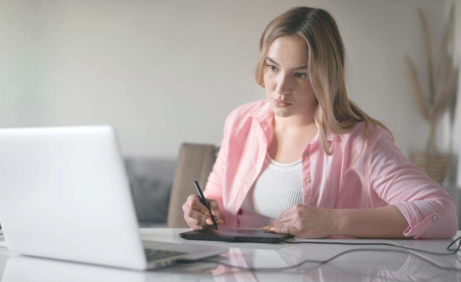 Person reviewing financial documents and planning budget